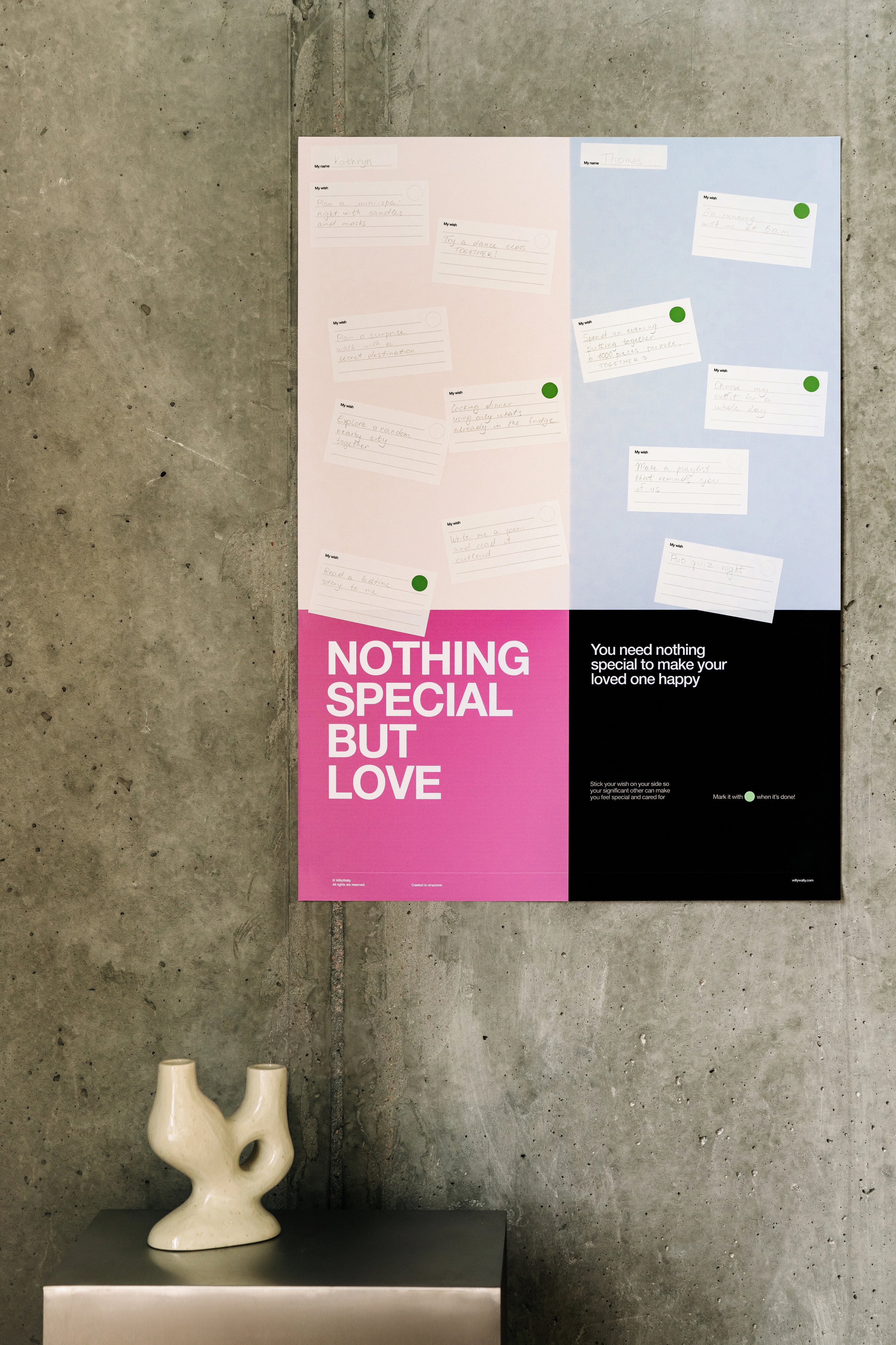 Wall with two posters featuring text and a small sculpture on a ledge.