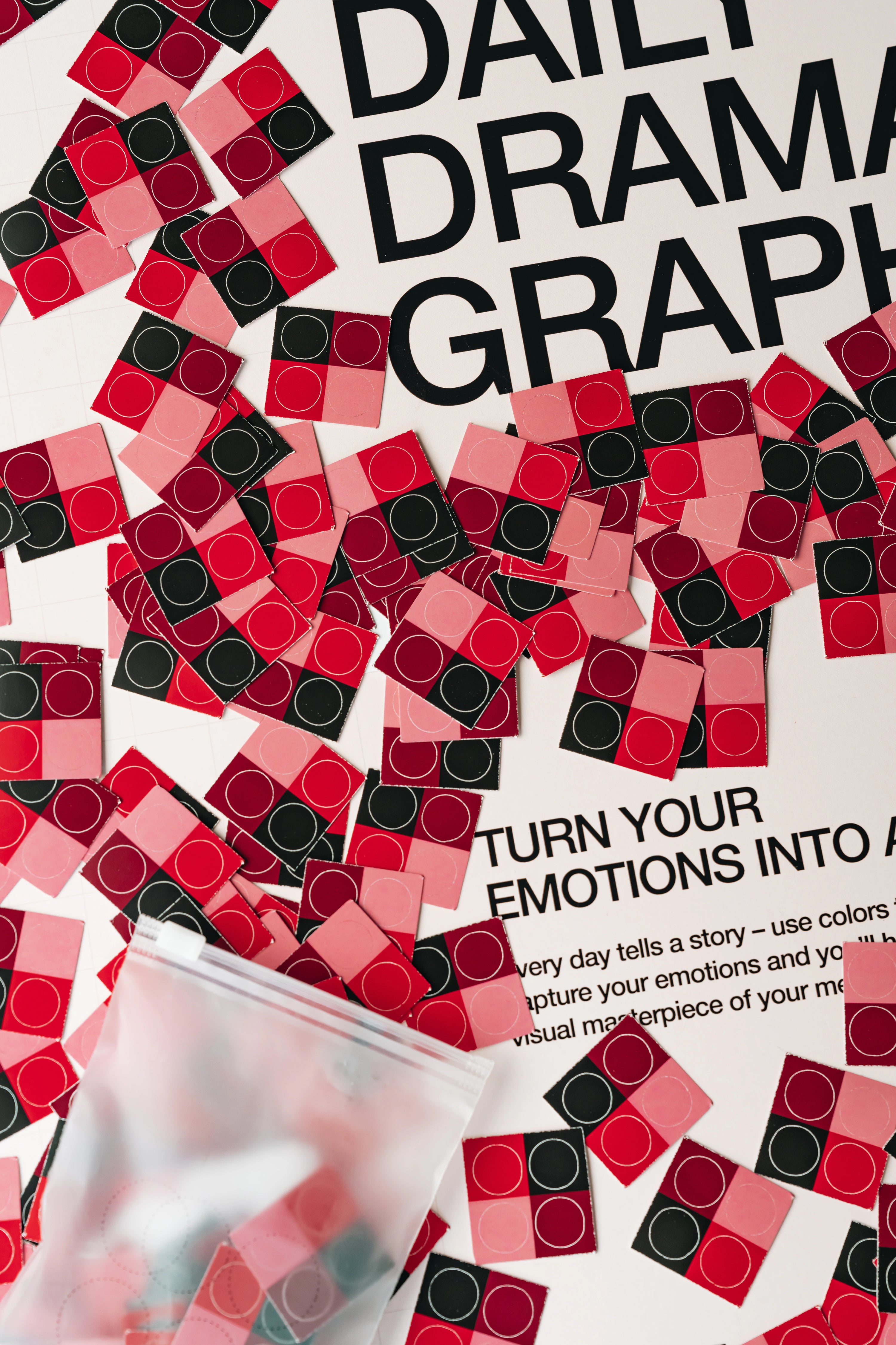 Color swatch book with red, black, and pink swatches on a white background